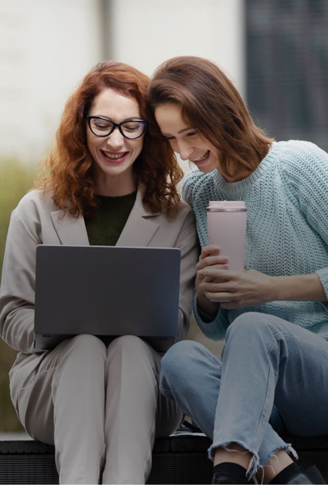 Girls looking at laptop