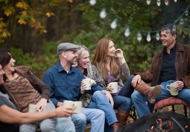 Friends laughing sitting autumn